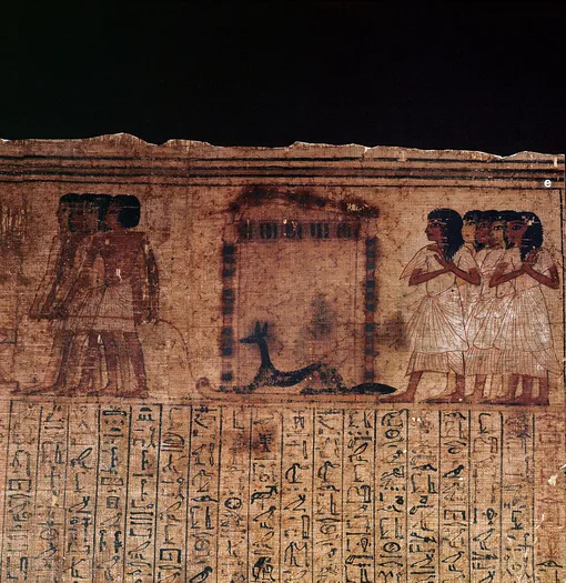 Виньетка из Книги мертвых Кенны. На ней изображен Анубис, нарисованный на санях.
